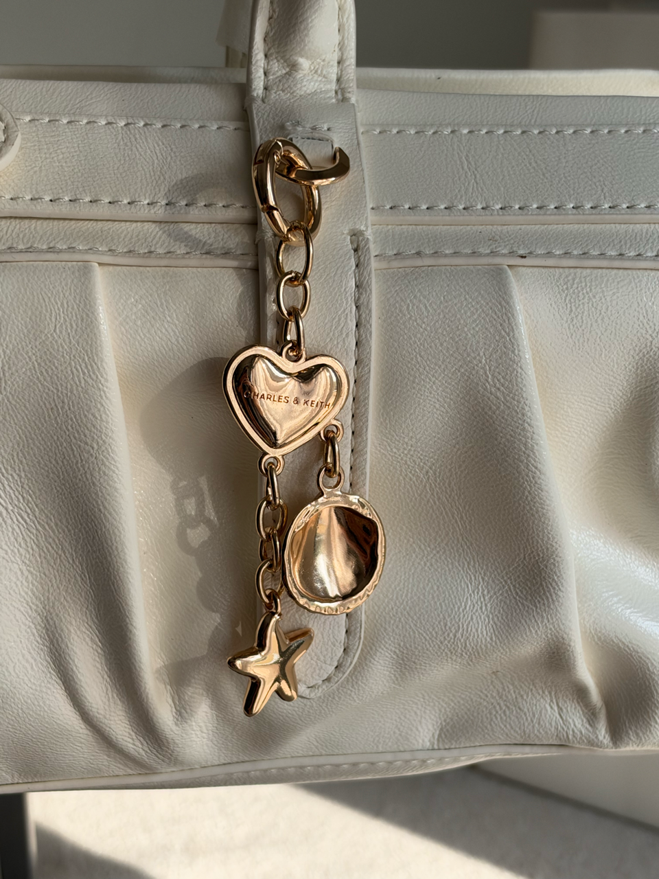 Ruched Shoulder Bag with Heart Charm With C & K Paper Bag - White